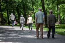 Men and Women walking on a path building their memory