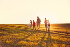 Family walking in a field